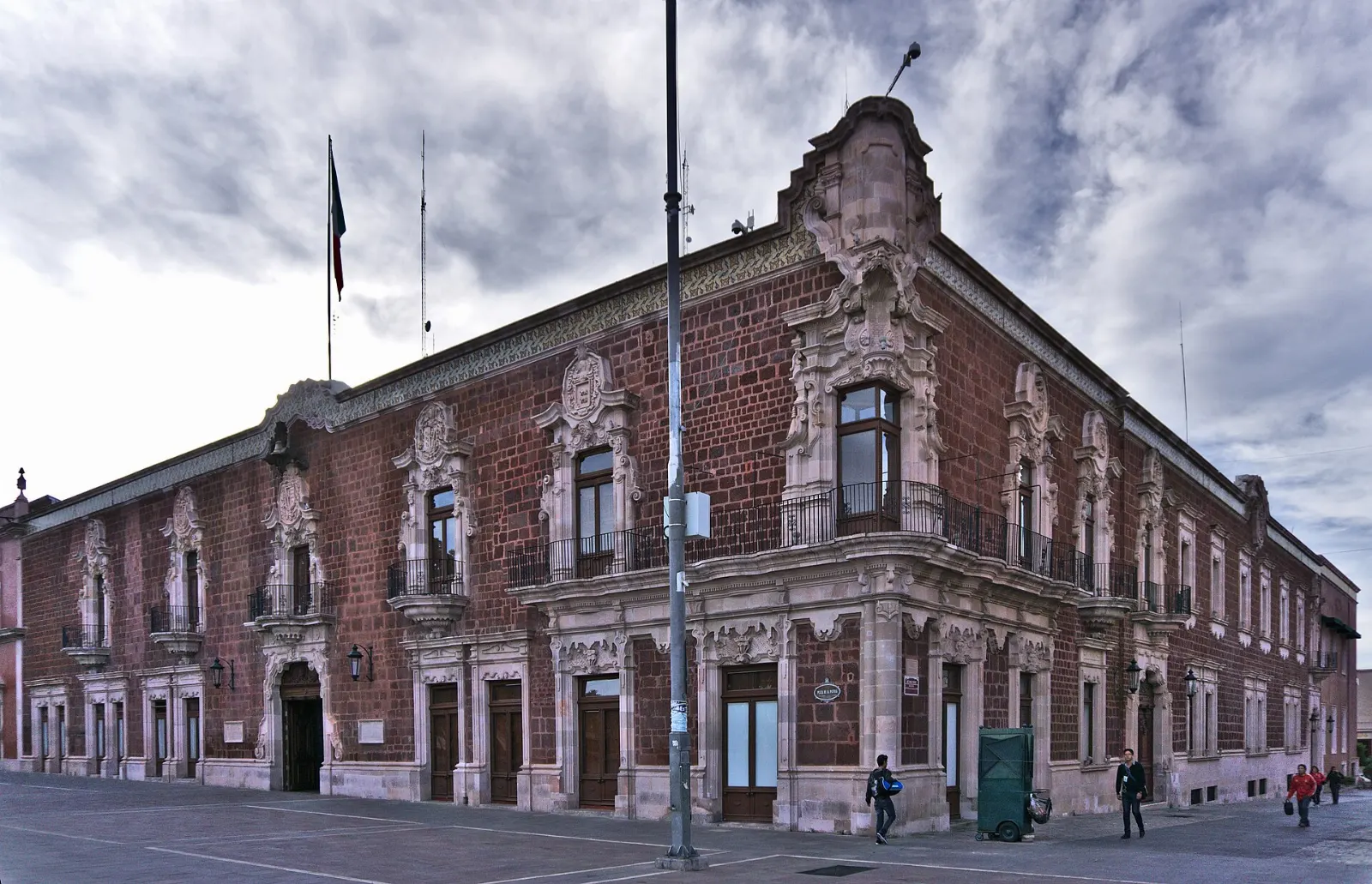 Red stone courtyard with arches in the Palacio de Gobierno in Aguascalientes