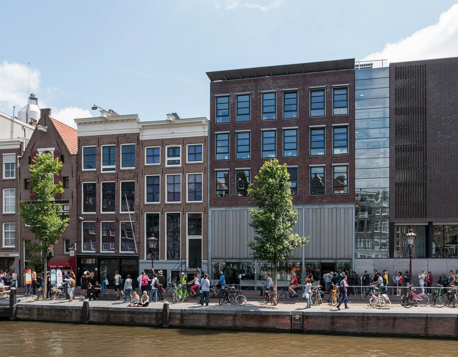 The narrow canal house of the Anne Frank House on the Prinsengracht beside the Westerkerk, Amsterdam, Netherlands