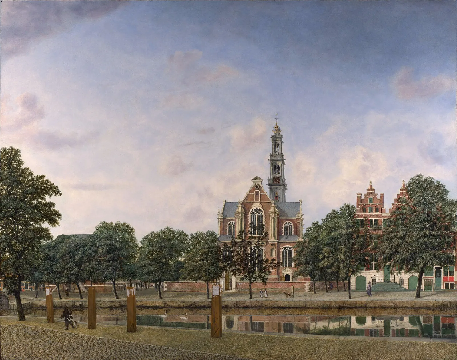 The tall spire of the Westerkerk rising above canal houses on the Prinsengracht, Amsterdam, Netherlands