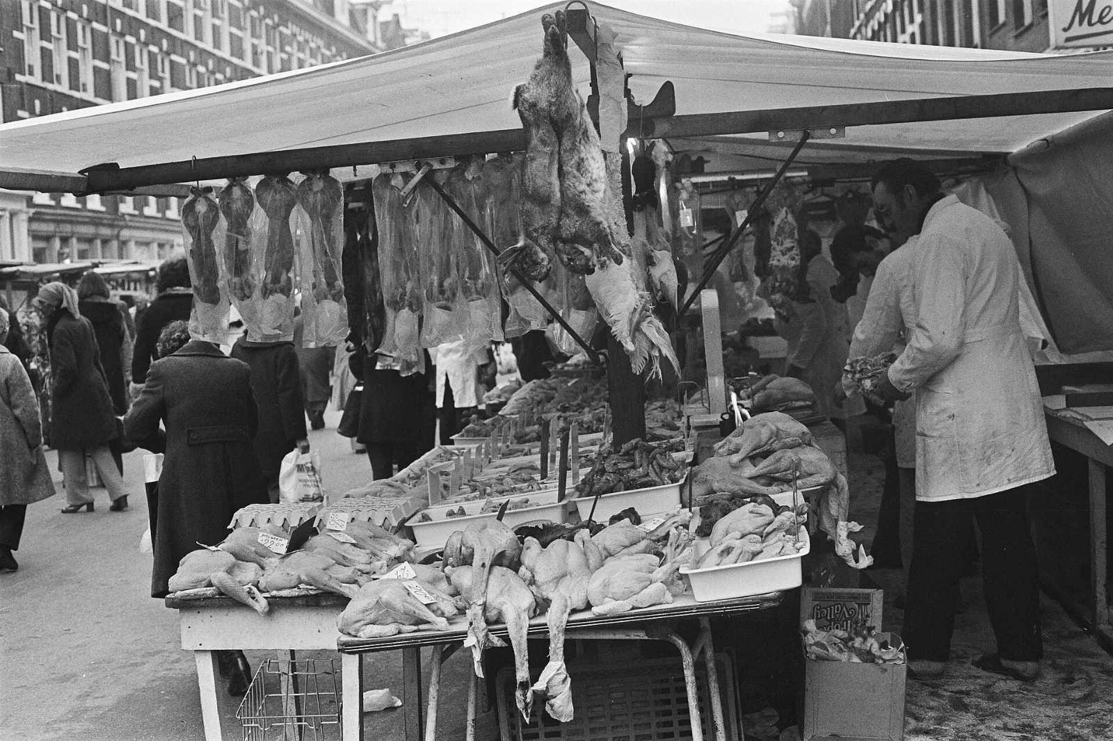 Market stalls with produce and awnings lining the Albert Cuypstraat in De Pijp, Amsterdam, Netherlands