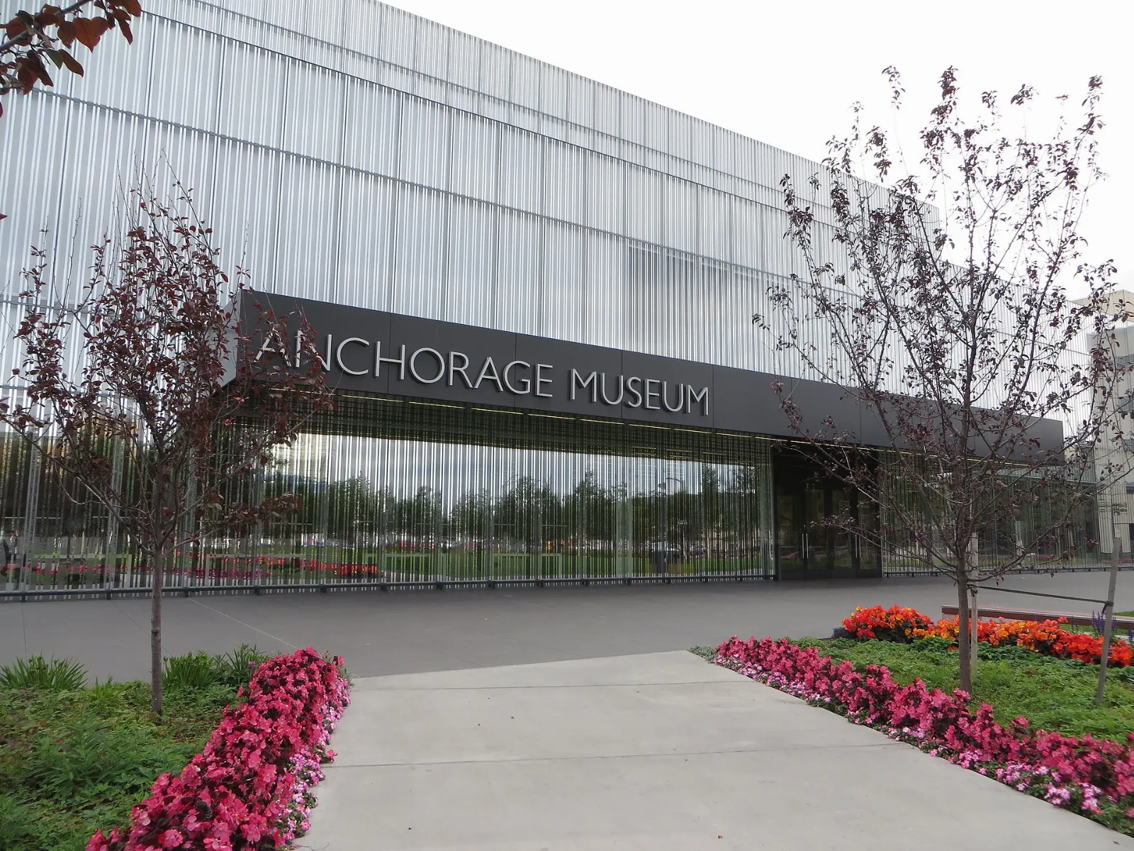 The reflective glass facade of the Anchorage Museum on a summer day, Alaska