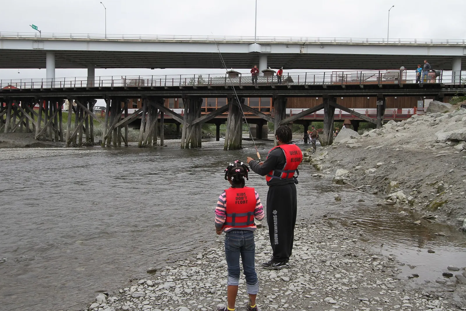 Anglers lining the banks of Ship Creek near downtown Anchorage, Alaska