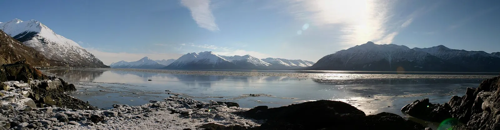 The waters of Turnagain Arm framed by steep mountains seen from Beluga Point, Anchorage, Alaska