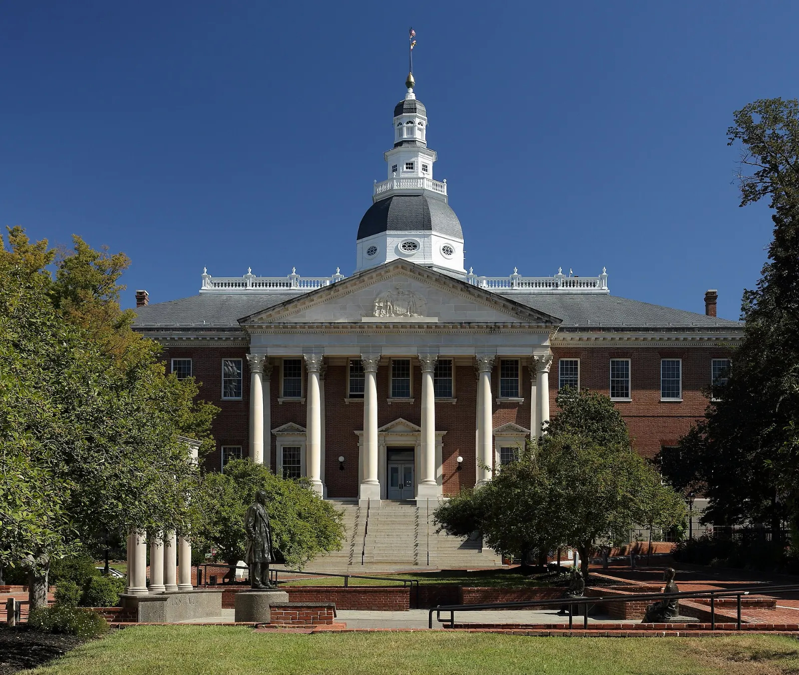 Georgian brick Maryland State House topped by its white wooden dome on State Circle, Annapolis, Maryland