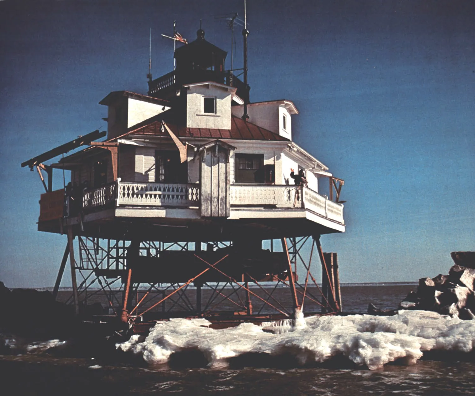 Hexagonal white screw-pile lighthouse standing on iron legs in the Chesapeake Bay, Annapolis, Maryland
