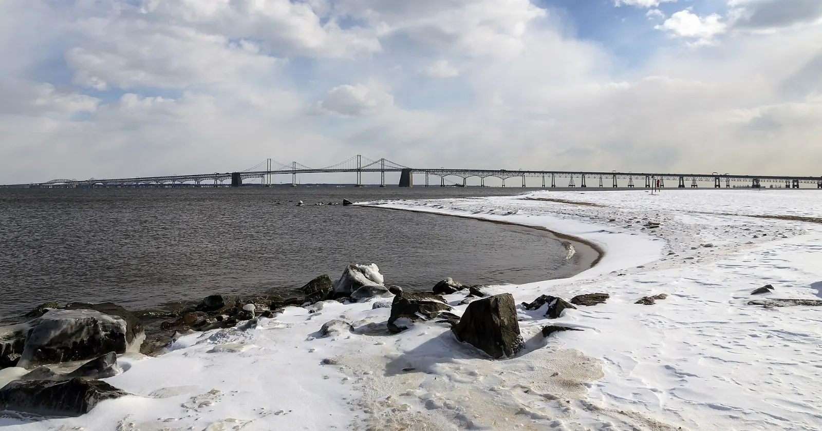 Twin spans of the Chesapeake Bay Bridge seen from the beach at Sandy Point, Annapolis, Maryland