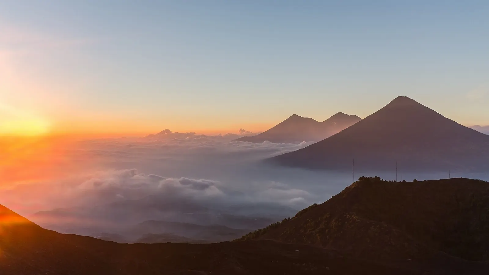 Volcán de Fuego erupting at dusk, seen from the slopes of Acatenango, Antigua, Guatemala