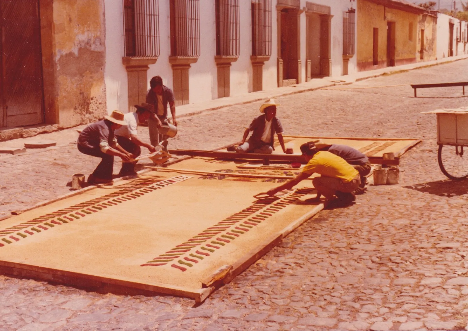 A colorful sawdust carpet laid on a cobbled street for a Holy Week procession, Antigua, Guatemala