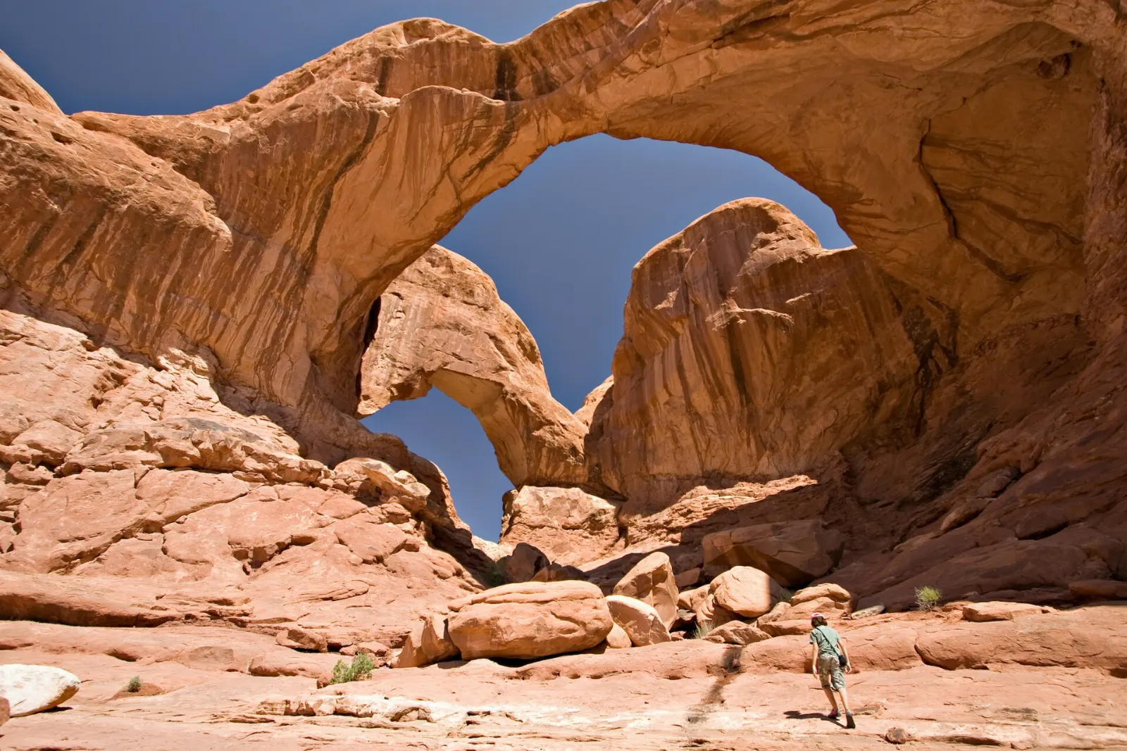 A large arch with a smaller arch directly beneath it in a sandstone fin, Arches National Park, Utah