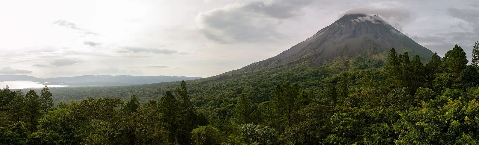 Lake Arenal stretching toward green hills with the volcano at one end, Costa Rica