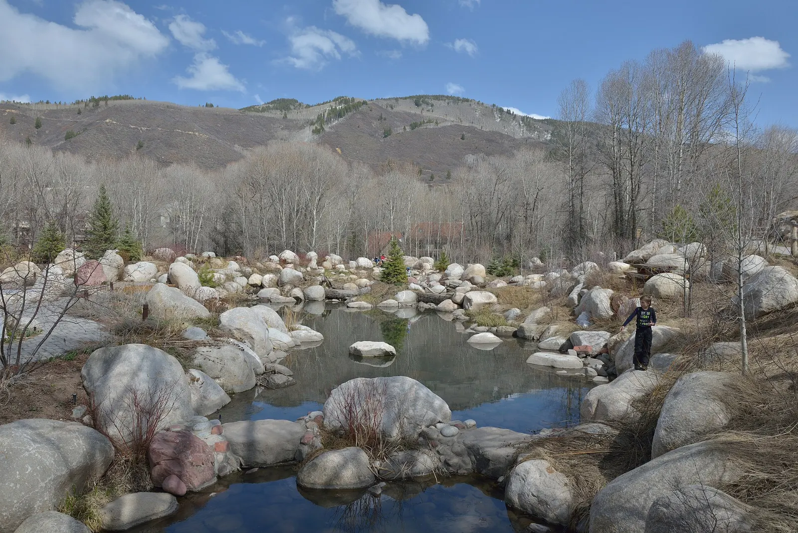Engraved boulders set among flowers and a stream at the John Denver Sanctuary, Aspen, Colorado
