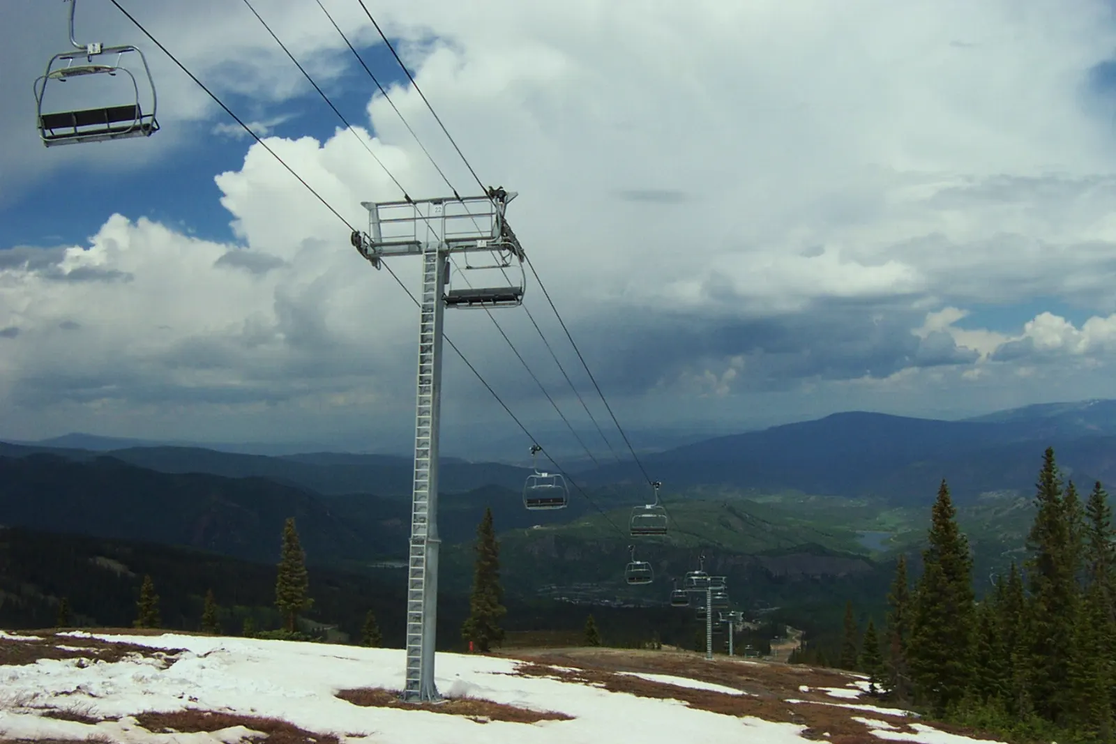 Ski slopes and lifts above the base village at Snowmass, Aspen, Colorado