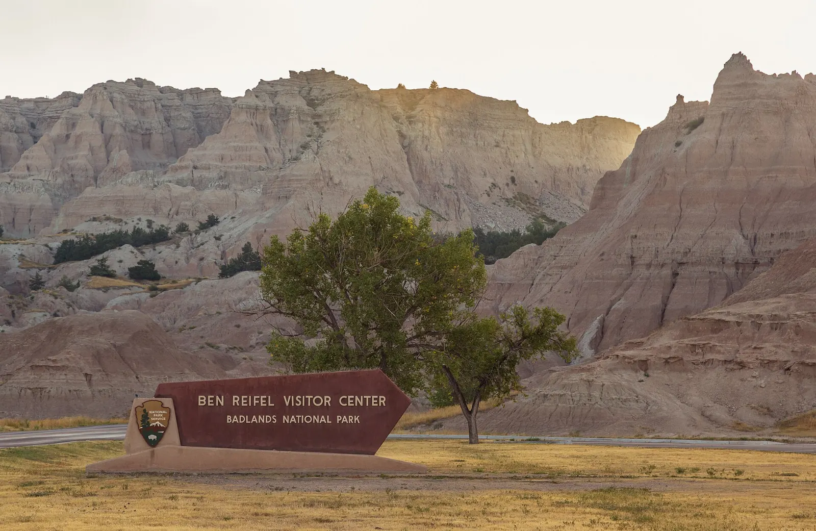 Ben Reifel Visitor Center at Cedar Pass with buttes behind, Badlands National Park, South Dakota