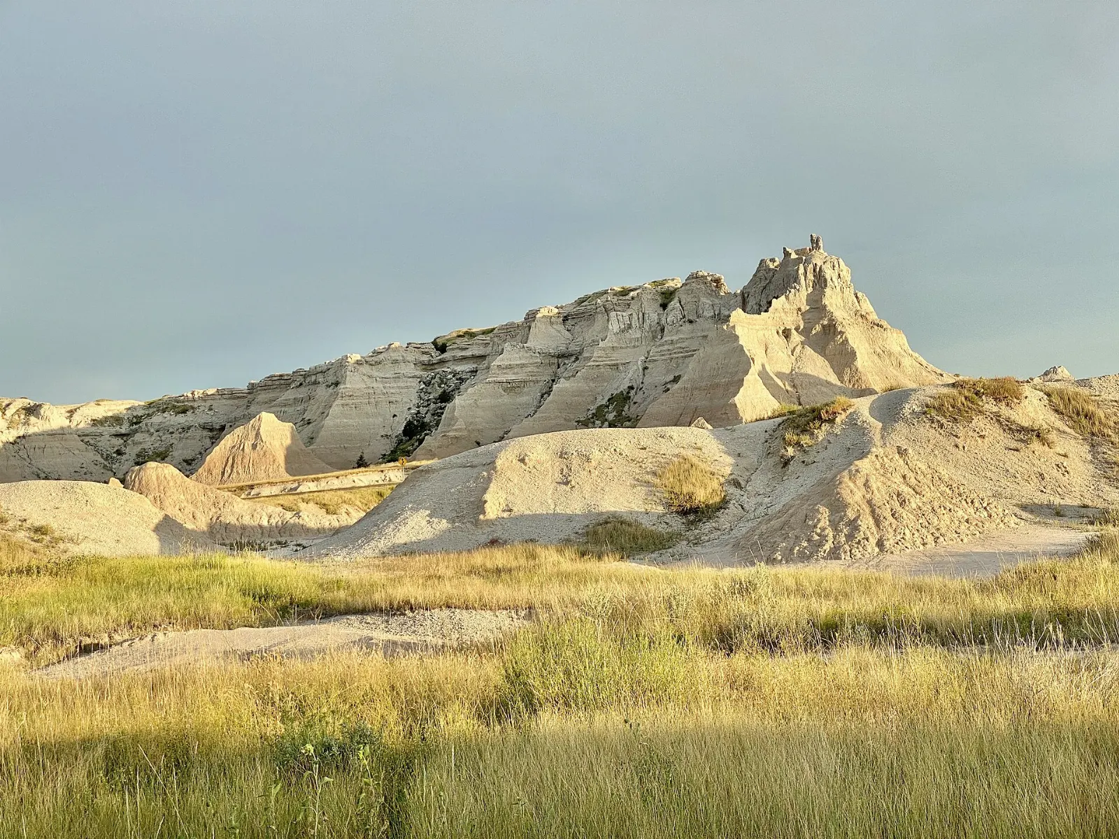 Boardwalk with fossil exhibits among eroded hills, Badlands National Park, South Dakota