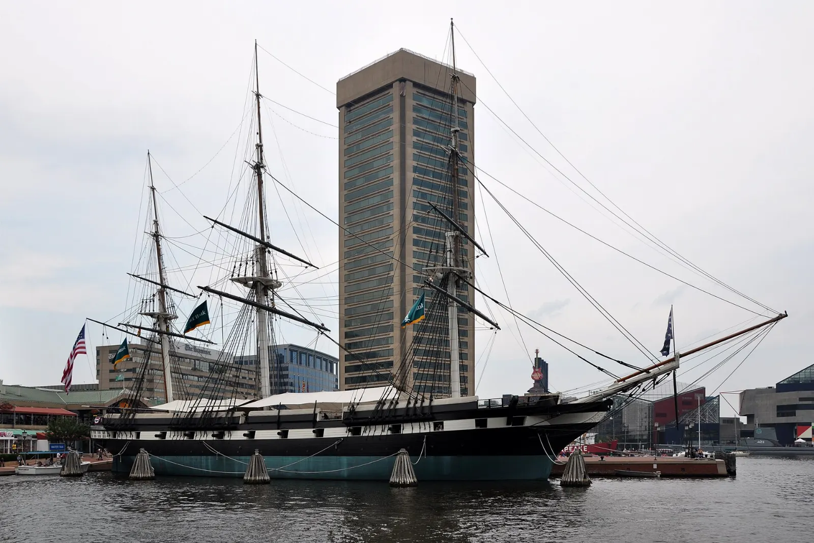Three-masted sloop-of-war USS Constellation moored at a pier in the Inner Harbor, Baltimore, Maryland