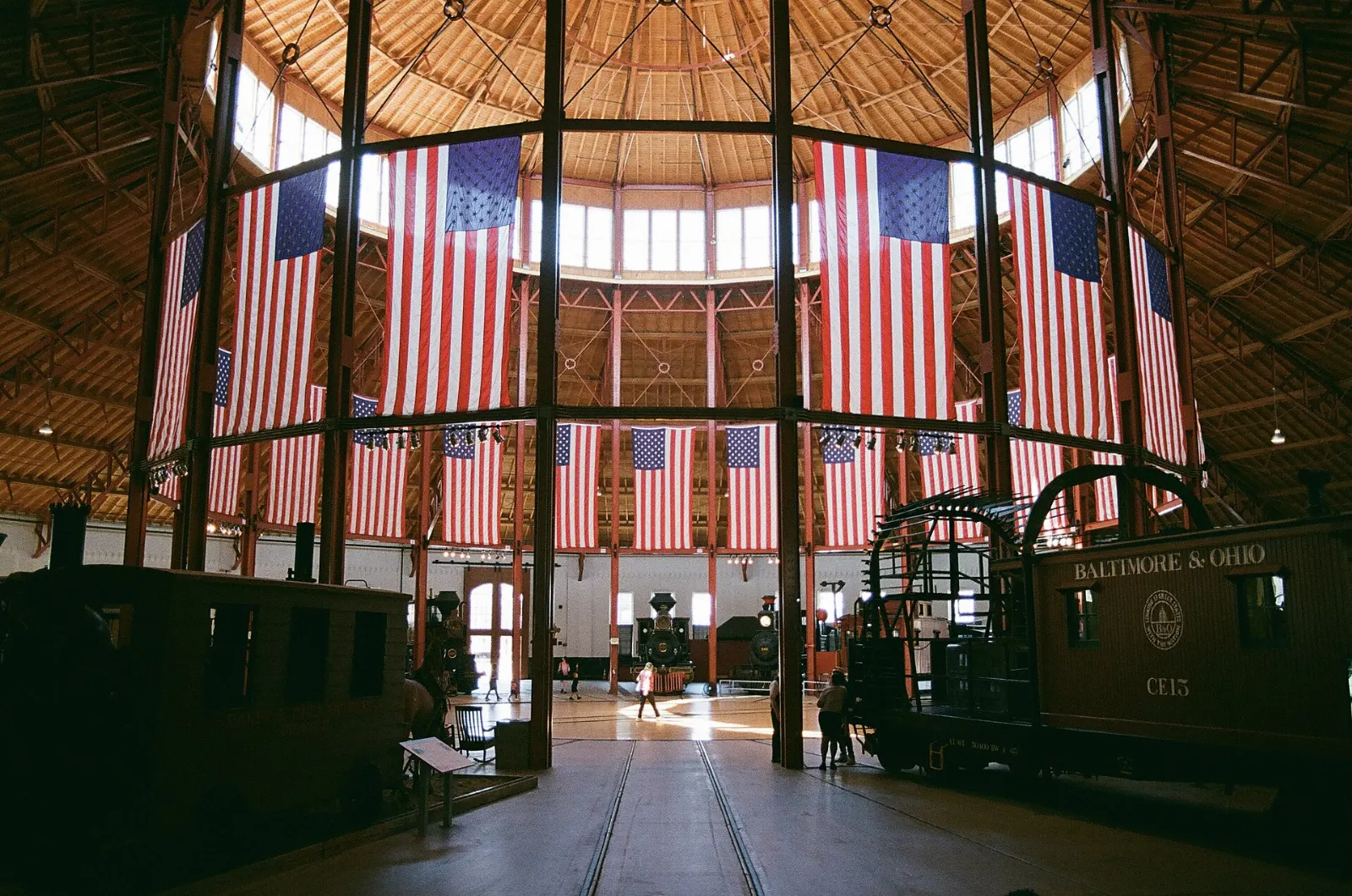 Historic locomotives arranged inside the circular roundhouse of the railroad museum, Baltimore, Maryland