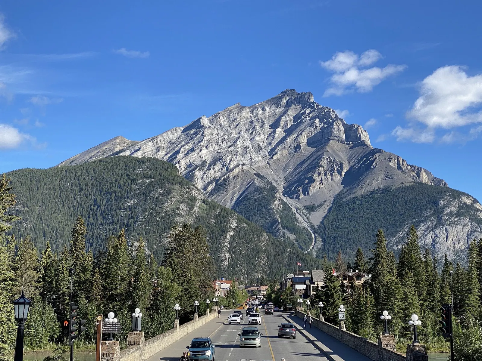 Banff Avenue with shops and Cascade Mountain rising at the end of the street, Banff National Park, Canada