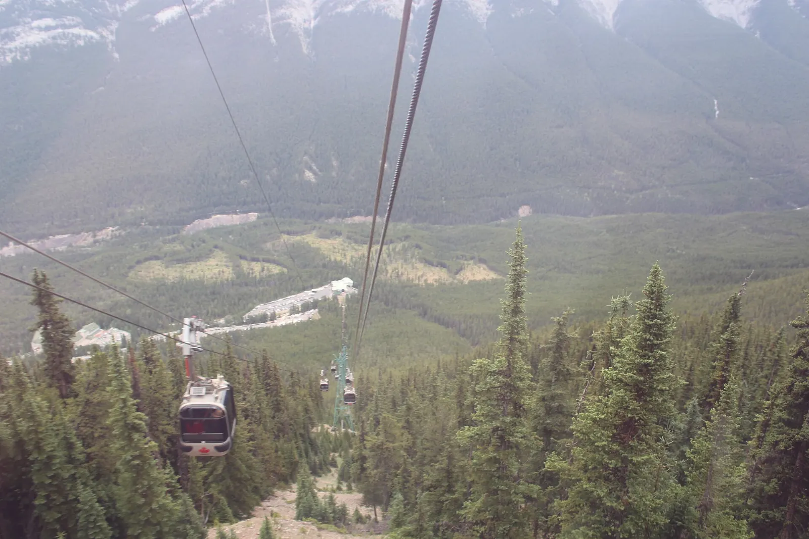 Gondola cabins rising up Sulphur Mountain above the Bow Valley, Banff National Park, Canada