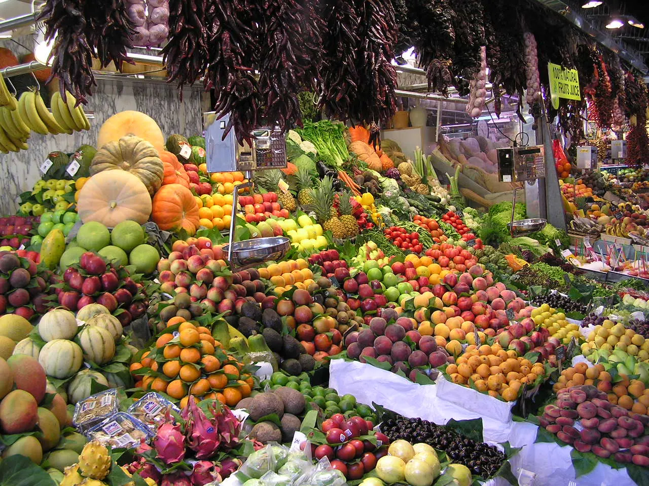 Fruit and produce stalls inside the Mercat de la Boqueria off La Rambla, Barcelona, Spain