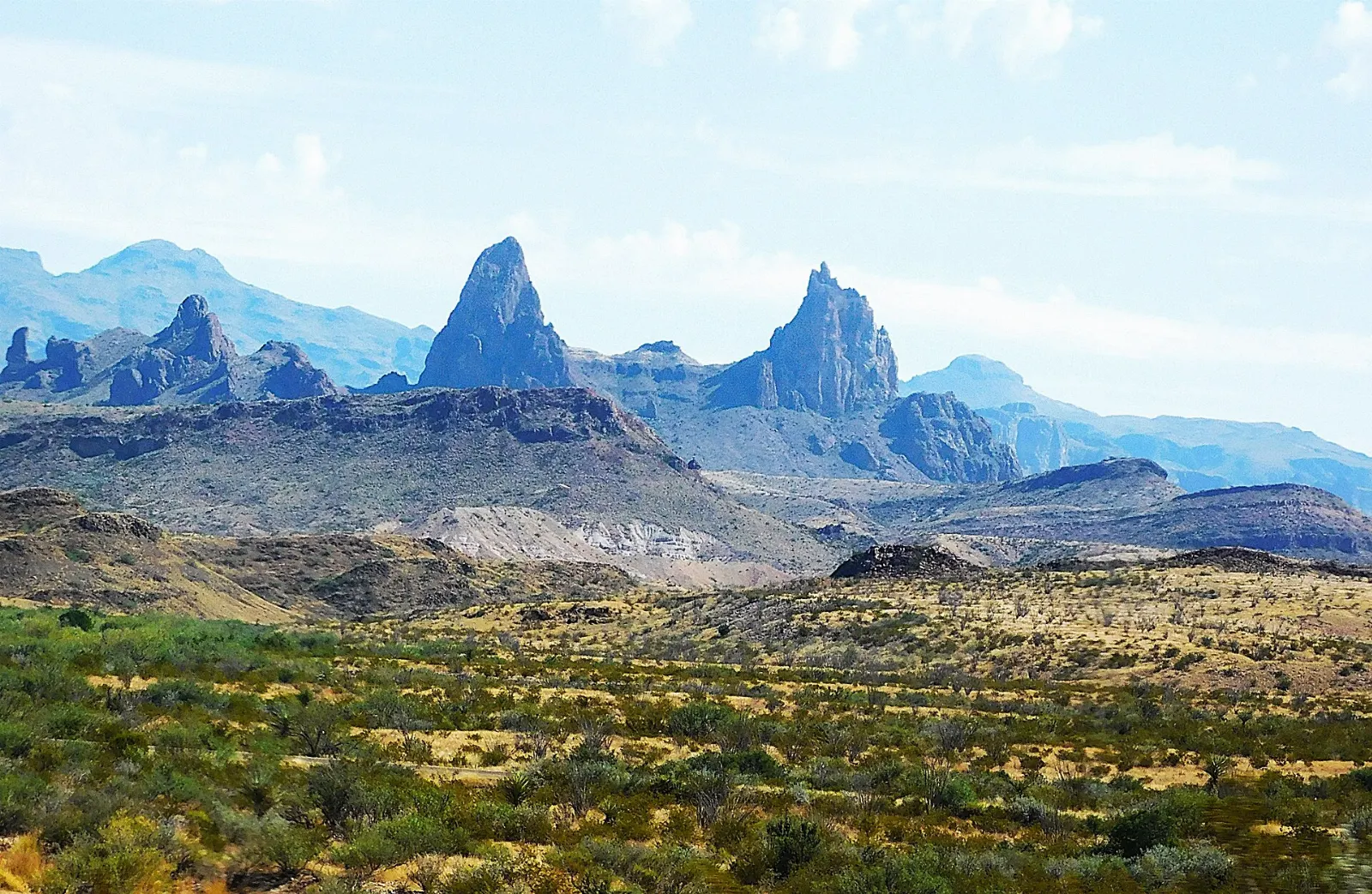 Twin rock spires known as the Mule Ears rising from the Chihuahuan Desert, Big Bend National Park, Texas