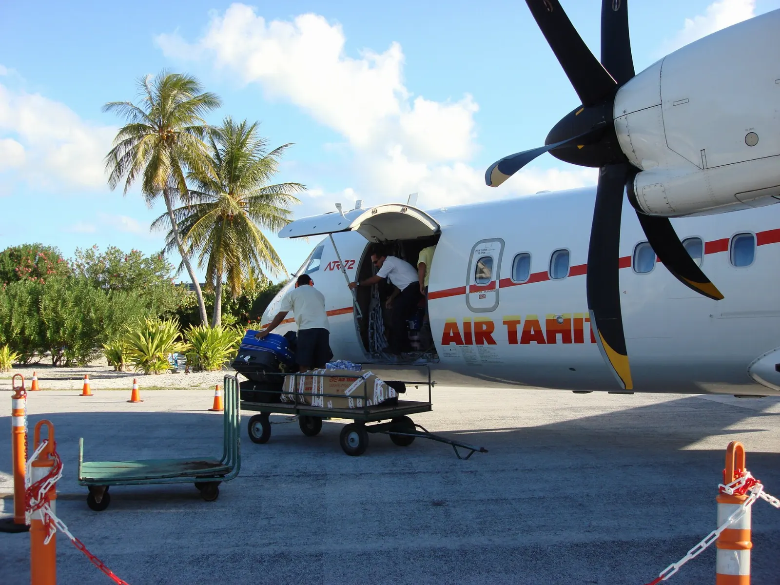 Small airport terminal and runway on the islet of Motu Mute in Bora Bora, French Polynesia