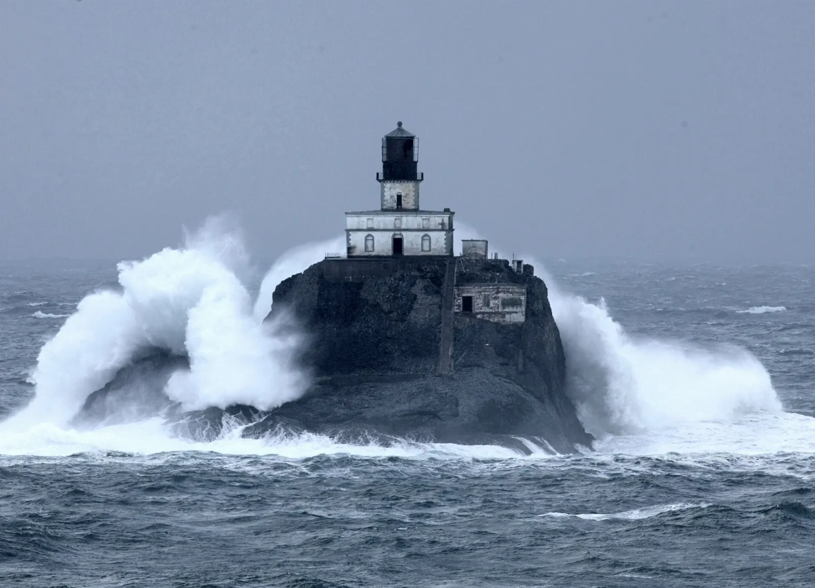 Tillamook Rock Lighthouse on a rocky island offshore from Tillamook Head, Cannon Beach, Oregon