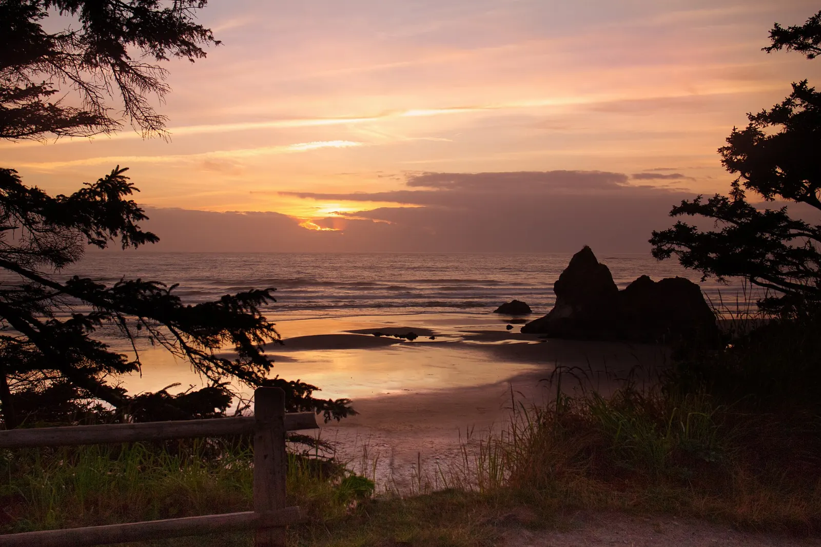 A quiet sandy beach with sea stacks offshore at Arcadia Beach south of Cannon Beach, Oregon