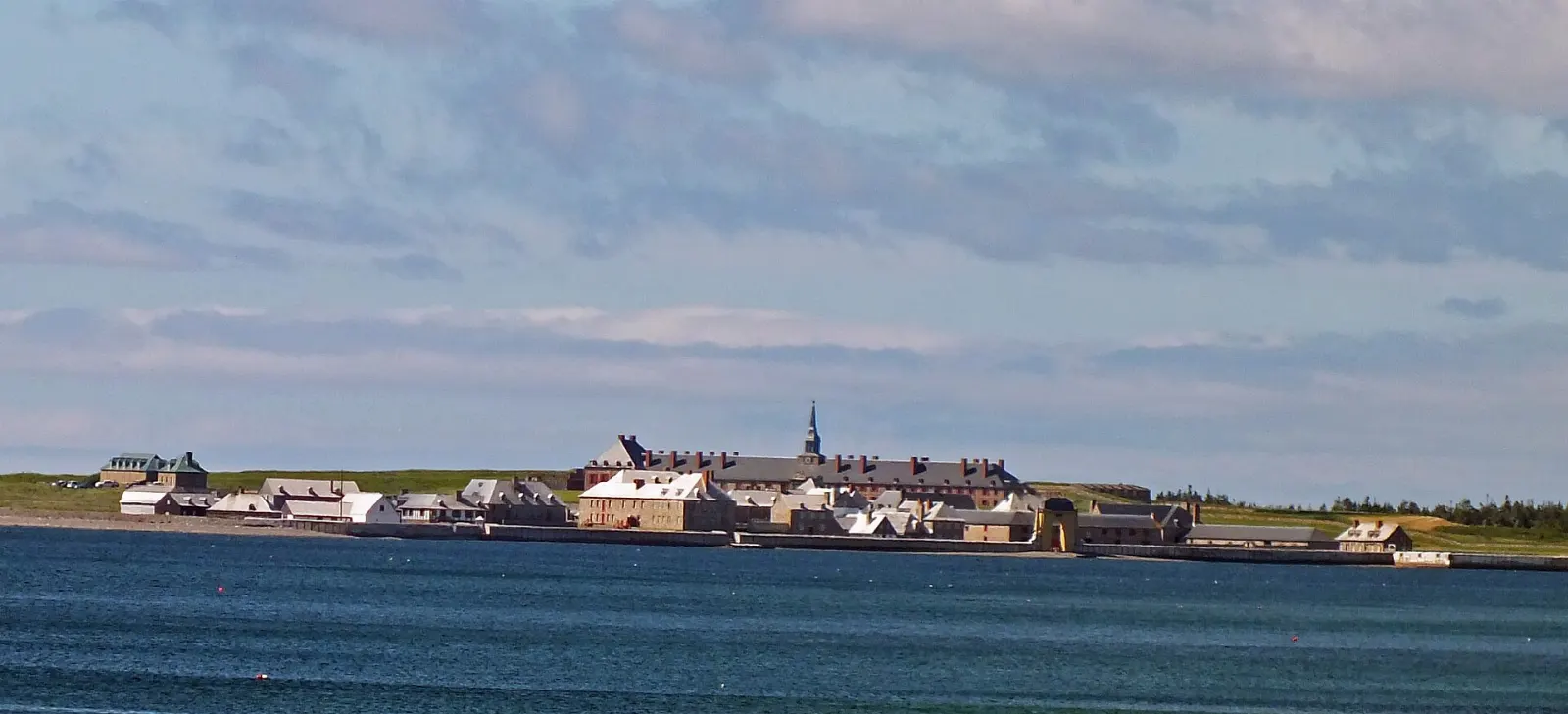 Reconstructed buildings and ramparts at the Fortress of Louisbourg, Cape Breton Island, Nova Scotia
