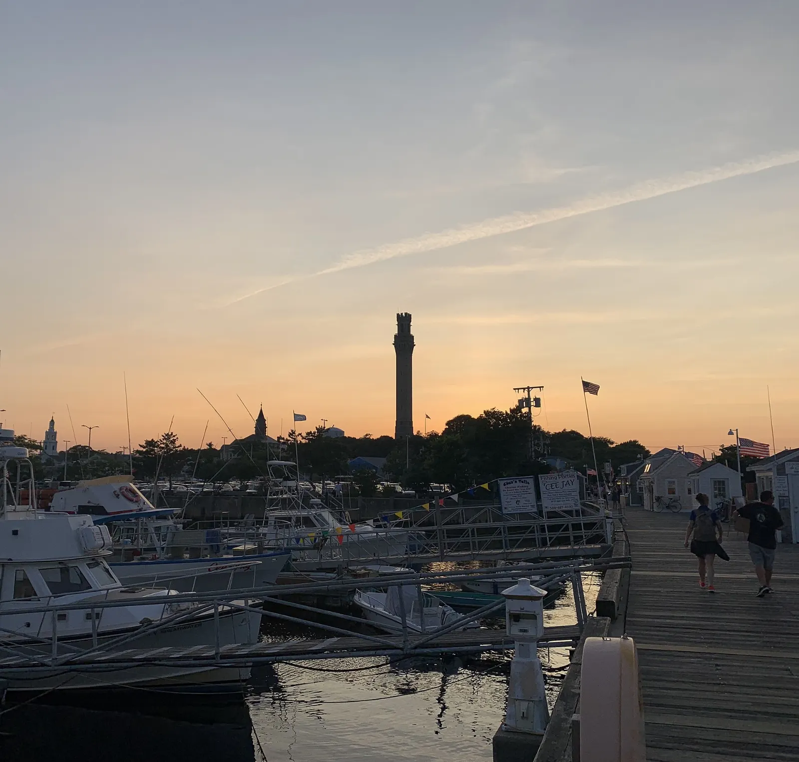 The tall granite Pilgrim Monument rising above the rooftops of Provincetown, Cape Cod, Massachusetts