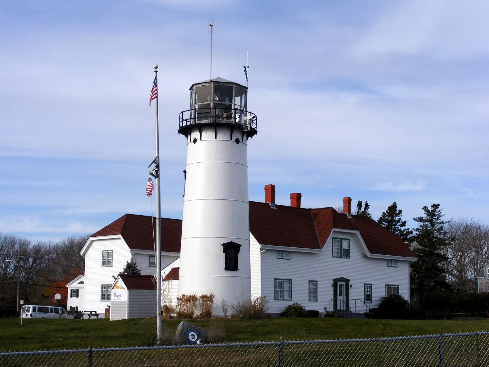 The white Chatham Lighthouse tower overlooking the harbor inlet and barrier beach, Cape Cod, Massachusetts