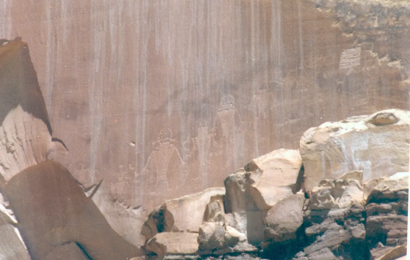 Ancient Fremont petroglyphs of human figures carved into a sandstone wall, Capitol Reef National Park, Utah