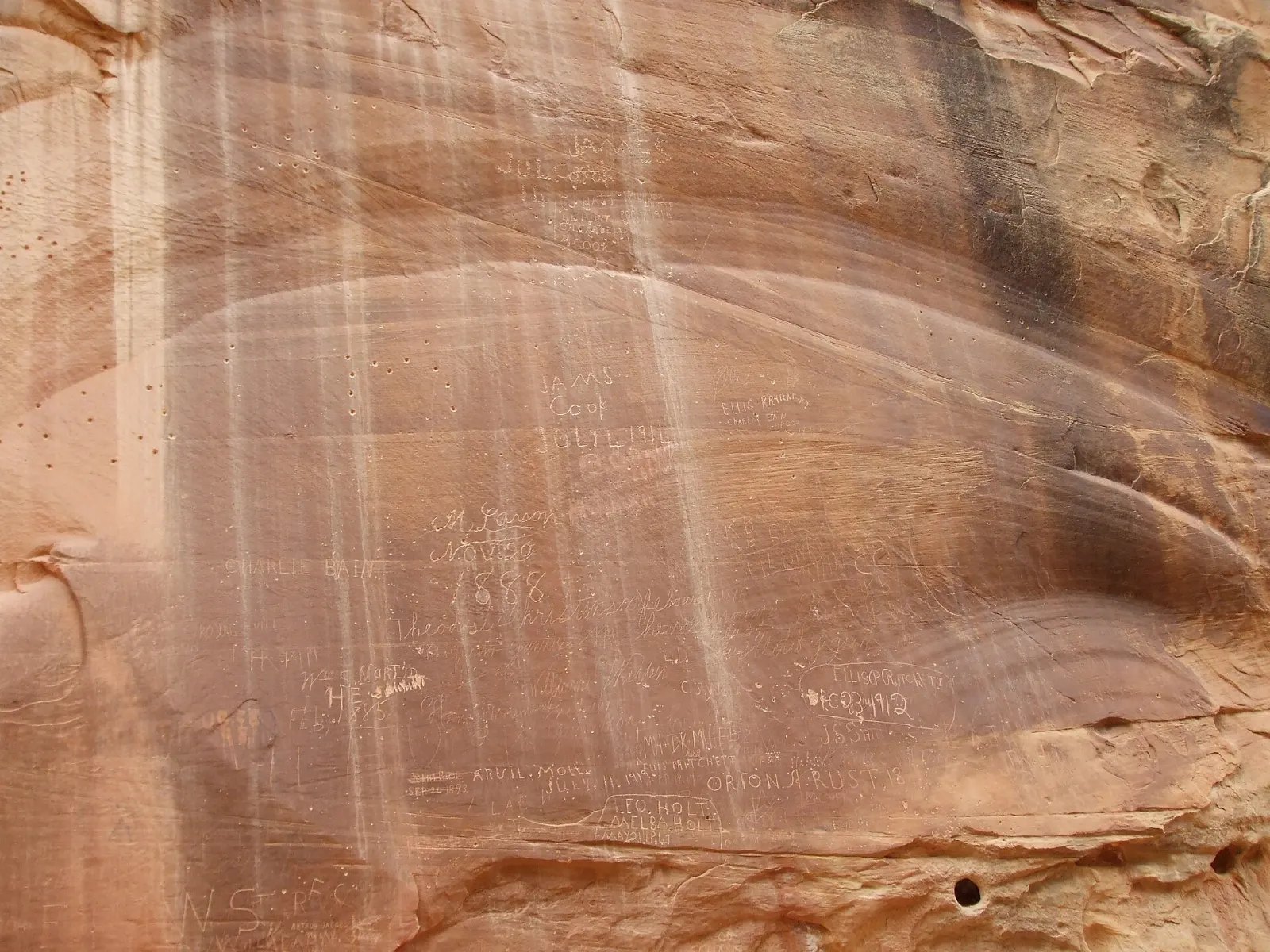 Names and dates carved by pioneers into a canyon wall in Capitol Gorge, Capitol Reef National Park, Utah