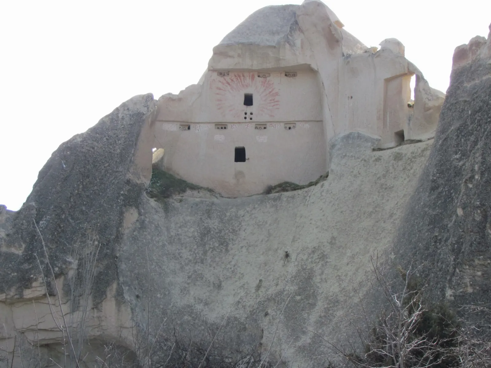 Valley of pale rock formations with carved dovecotes between Uçhisar and Göreme, Cappadocia, Türkiye