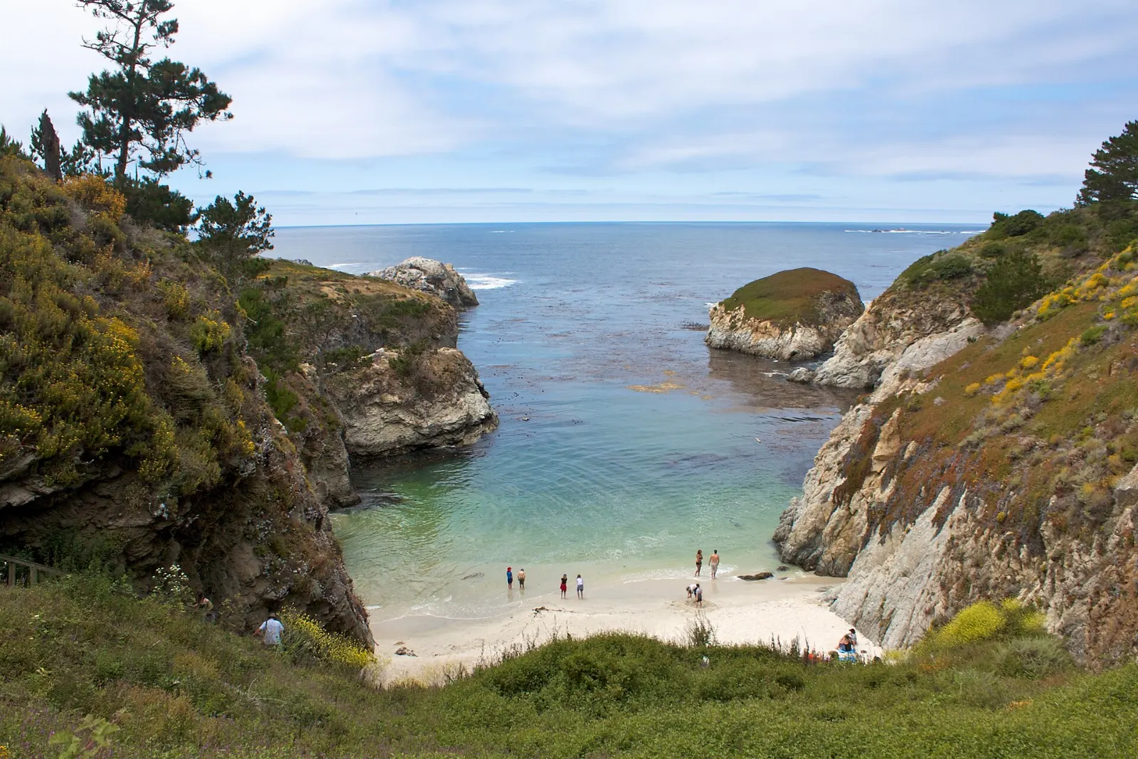 Emerald water and a small sandy cove at China Cove, Carmel-by-the-Sea, California