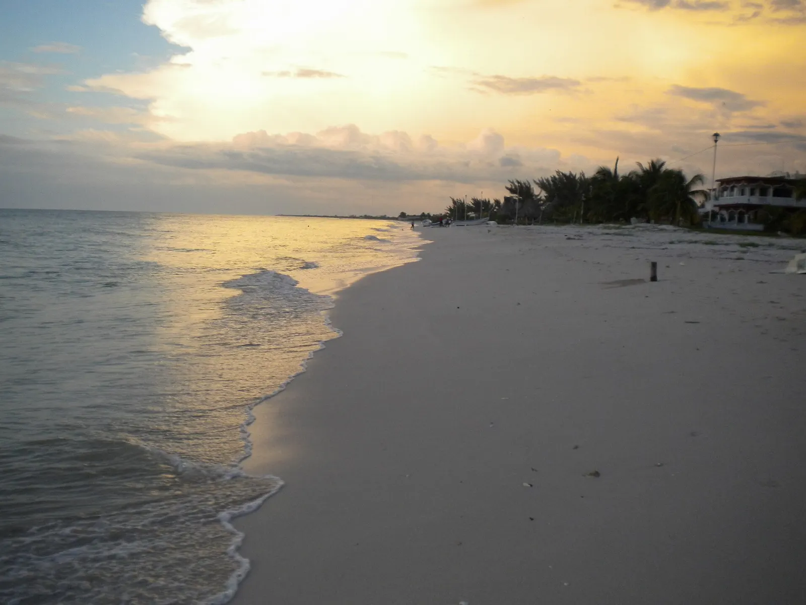 Wide sandy beach with calm green water at Celestún, Yucatán