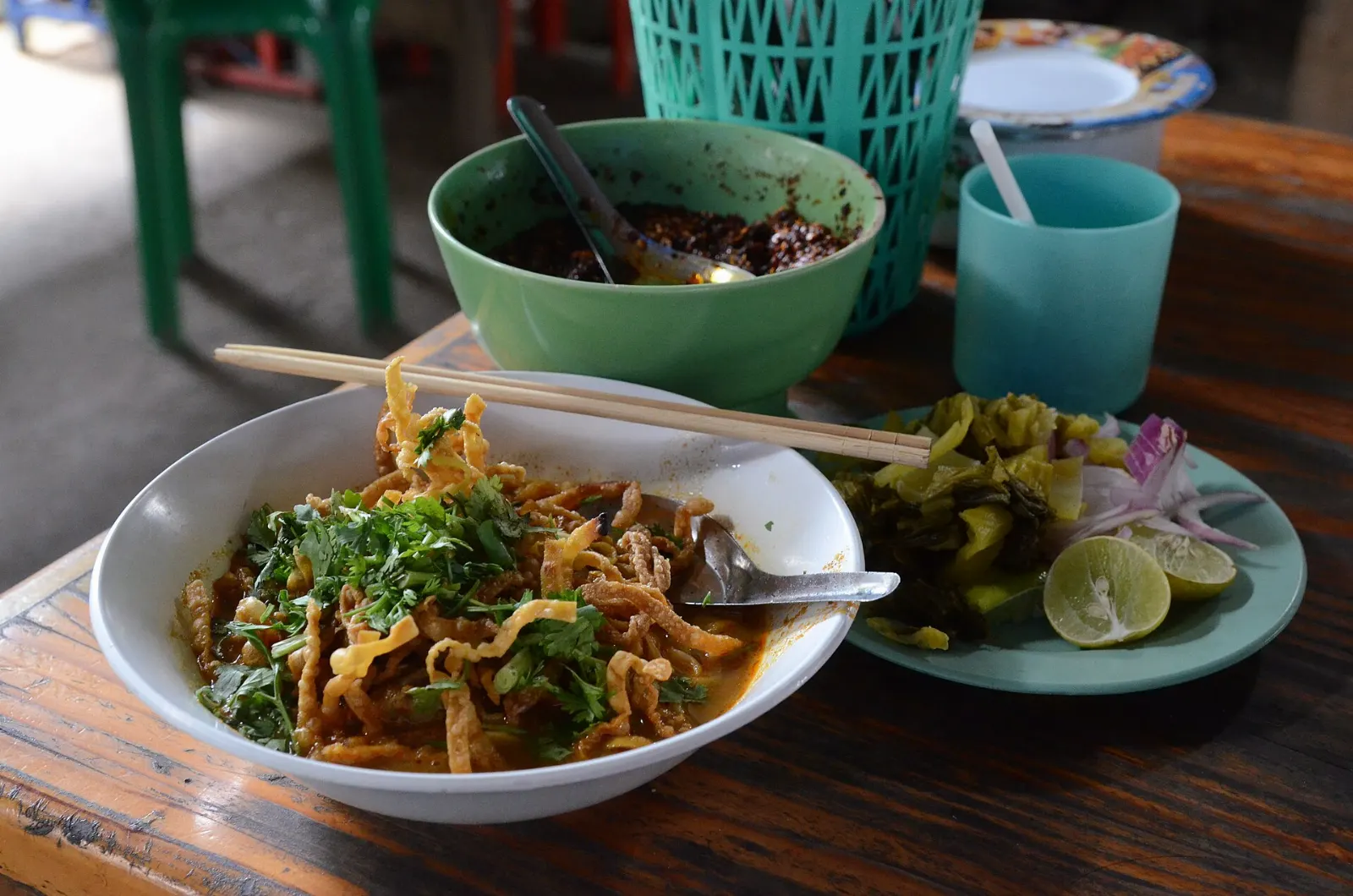A bowl of khao soi curry noodle soup topped with crispy fried noodles, Chiang Mai, Thailand
