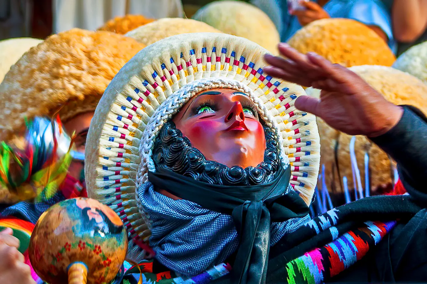 A parachico dancer in carved wooden mask and striped shawl during the Fiesta Grande, Chiapa de Corzo, Chiapas