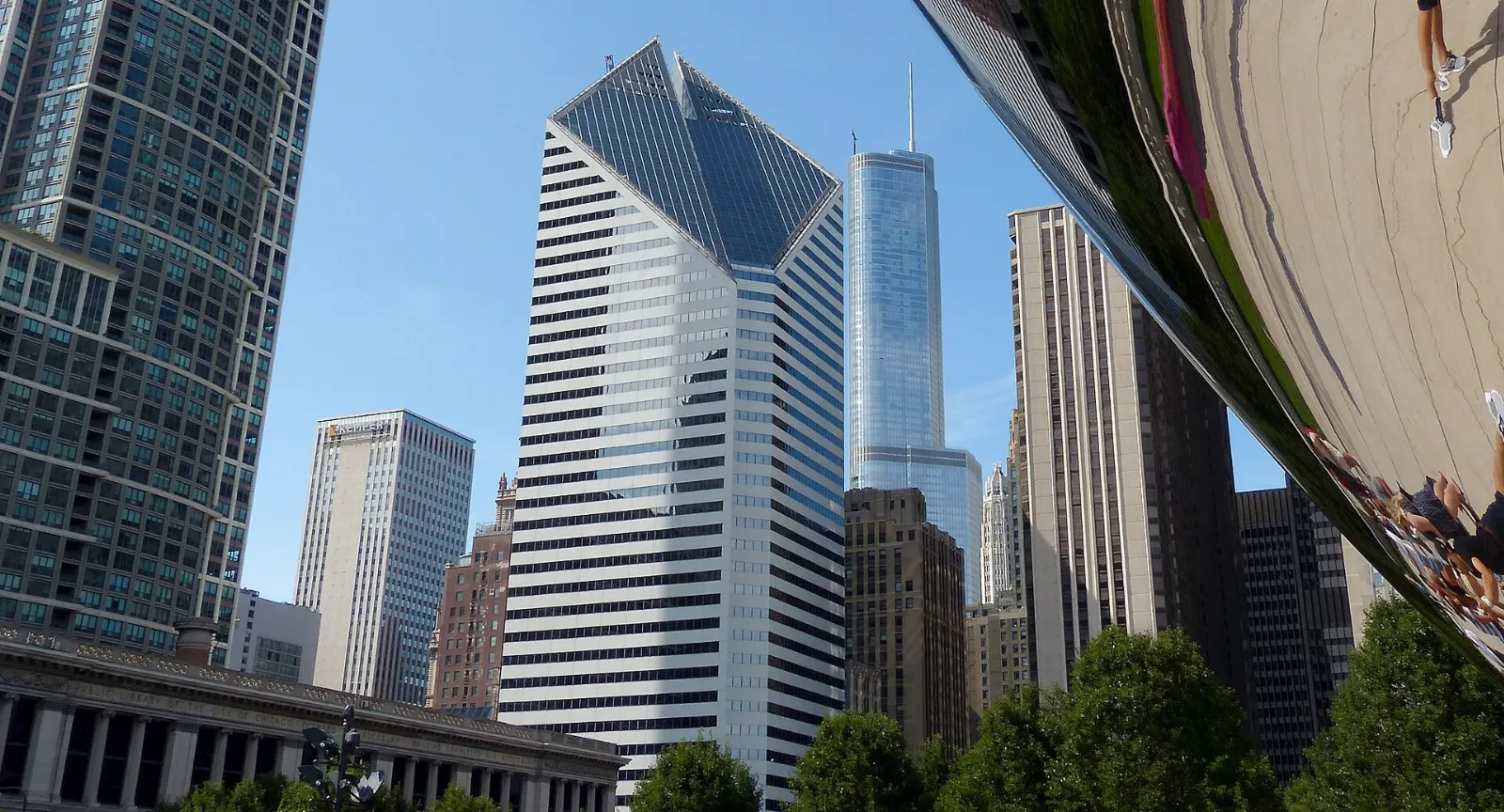 The mirrored steel Cloud Gate sculpture reflecting the Chicago skyline in Millennium Park, Illinois