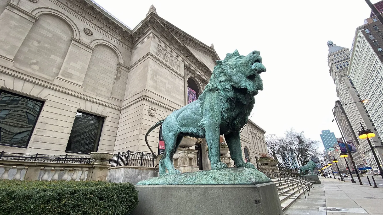 Bronze lion statue guarding the Michigan Avenue entrance of the Art Institute of Chicago, Illinois