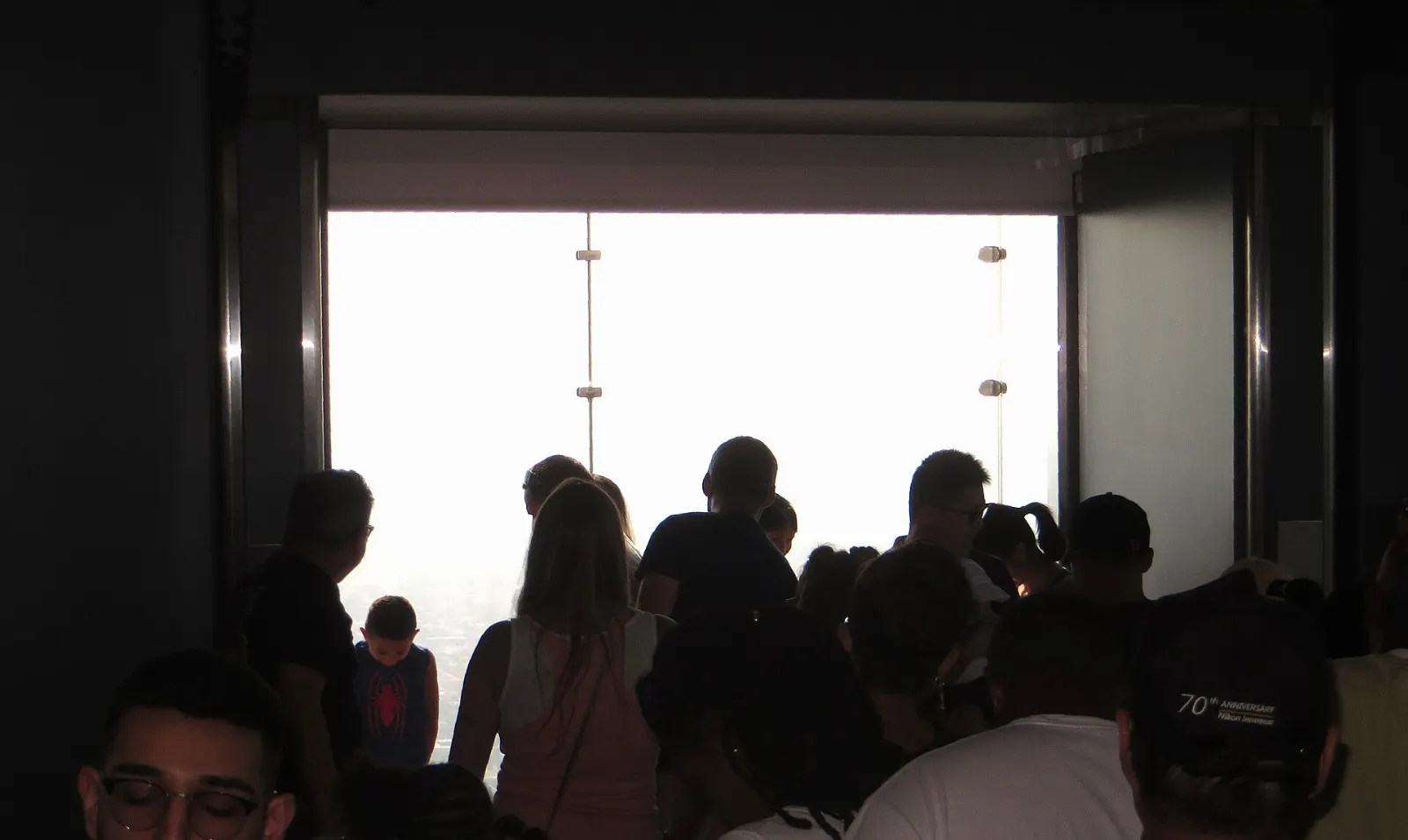 Glass box ledge projecting from the Willis Tower Skydeck high above Chicago streets, Illinois