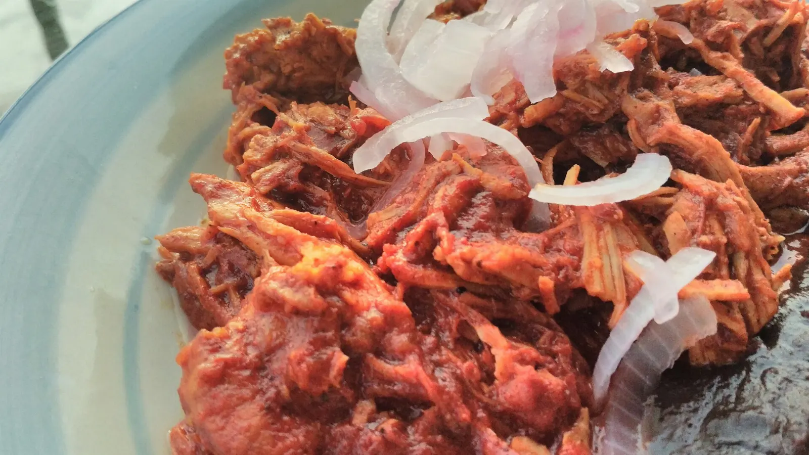 Cochinita pibil served with pickled onion, Chichén Itzá, Yucatán