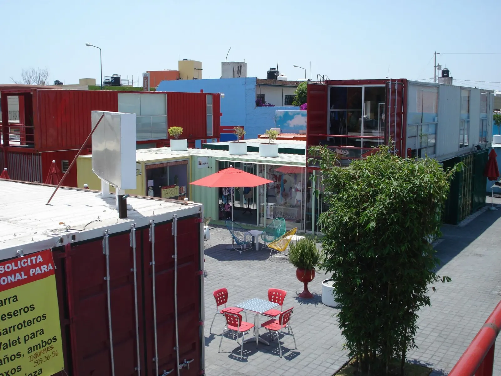 Brightly painted shipping containers used as shops and restaurants in Cholula, Puebla