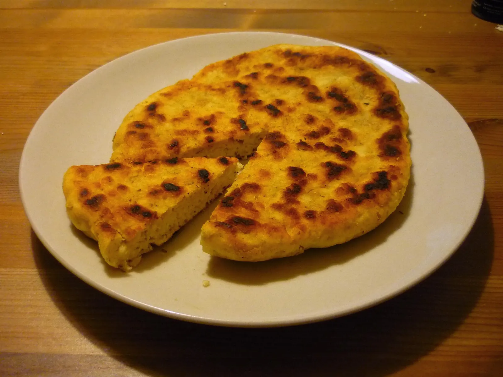 Golden bannock bread served on a plate, Churchill, Manitoba