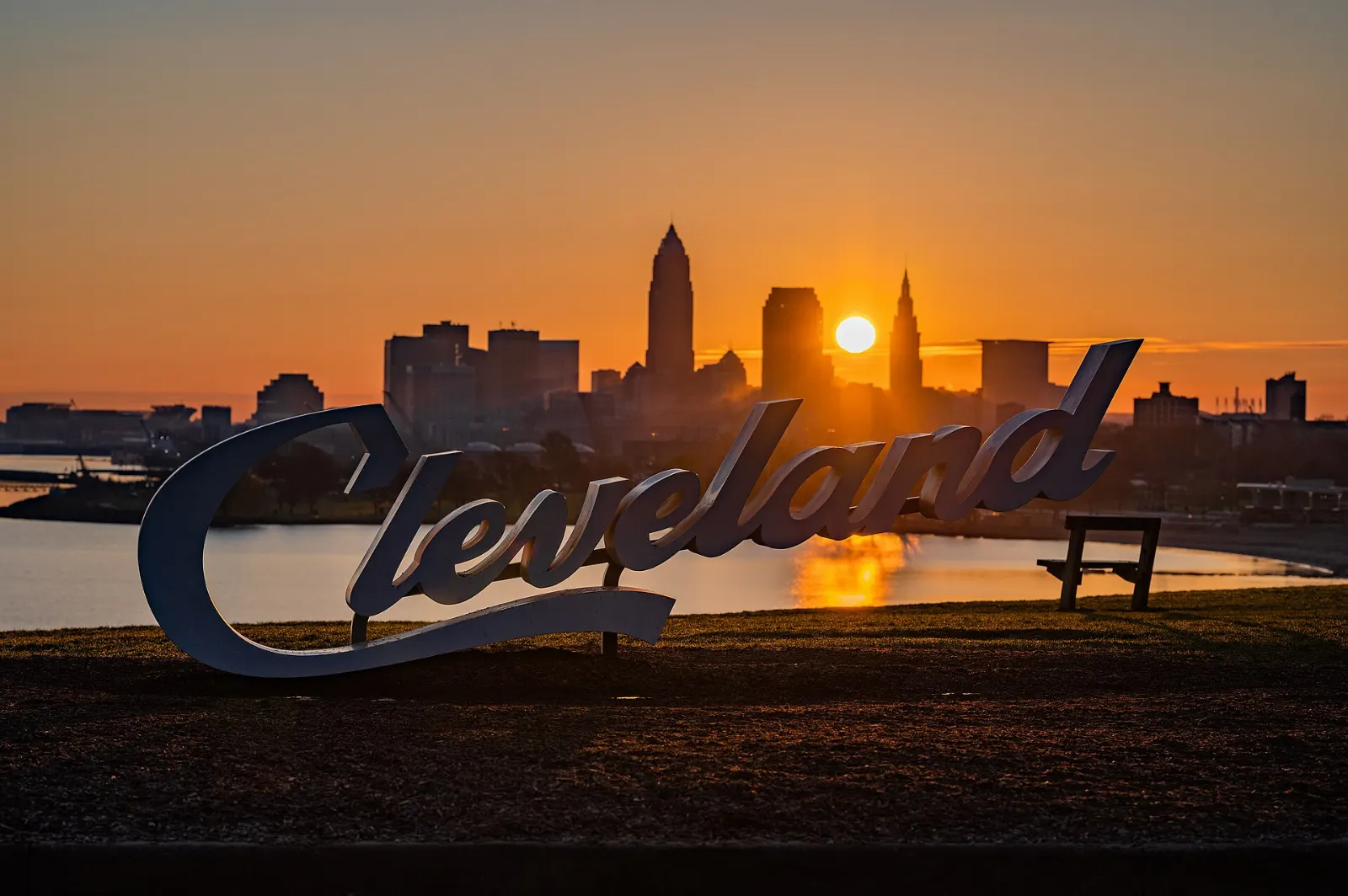 The Cleveland script sign at Edgewater Park with the downtown skyline behind it, Ohio