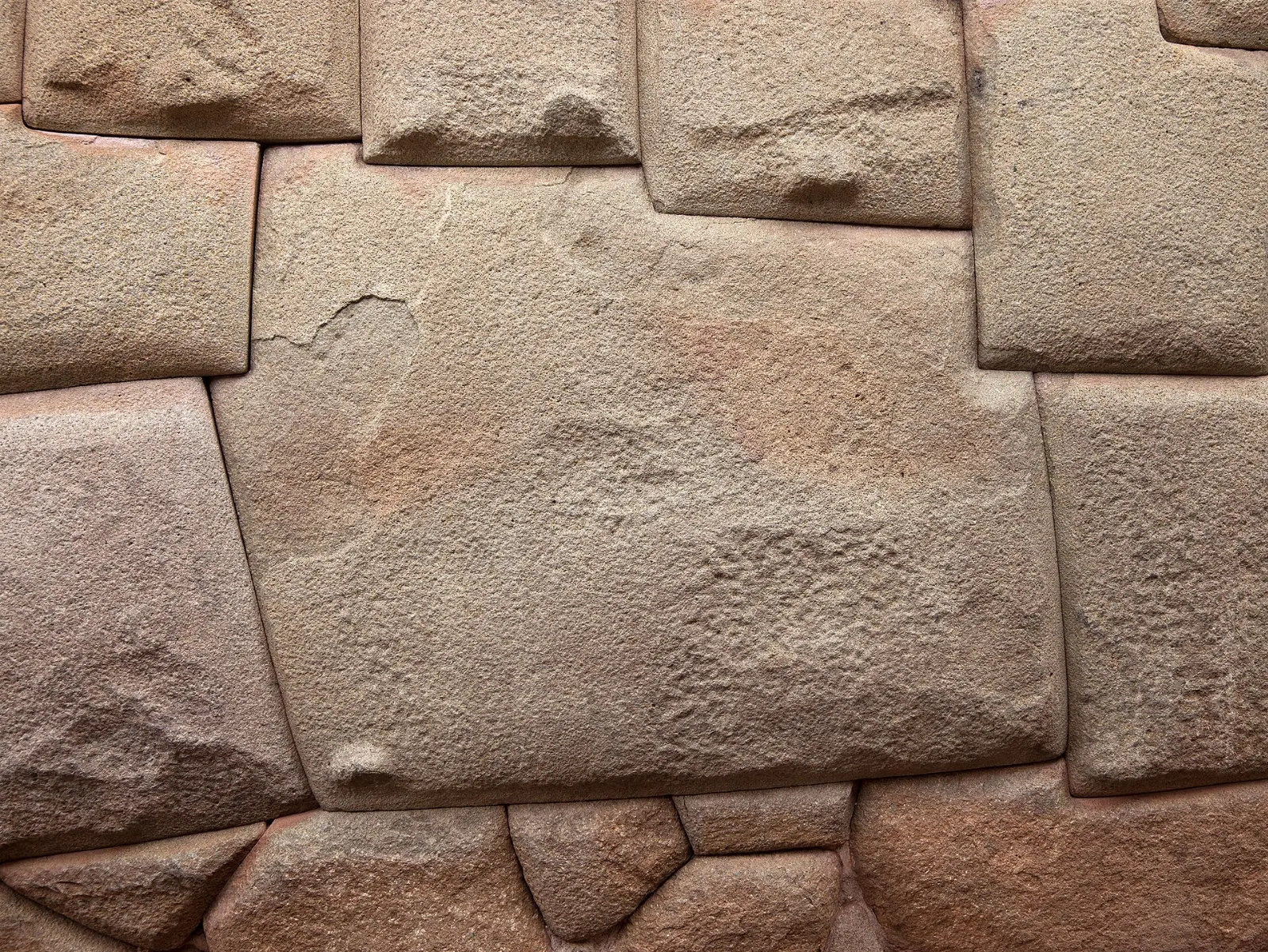 The famous twelve-angled stone fitted into an Inca wall on Hatun Rumiyoc street, Cusco and Machu Picchu, Peru