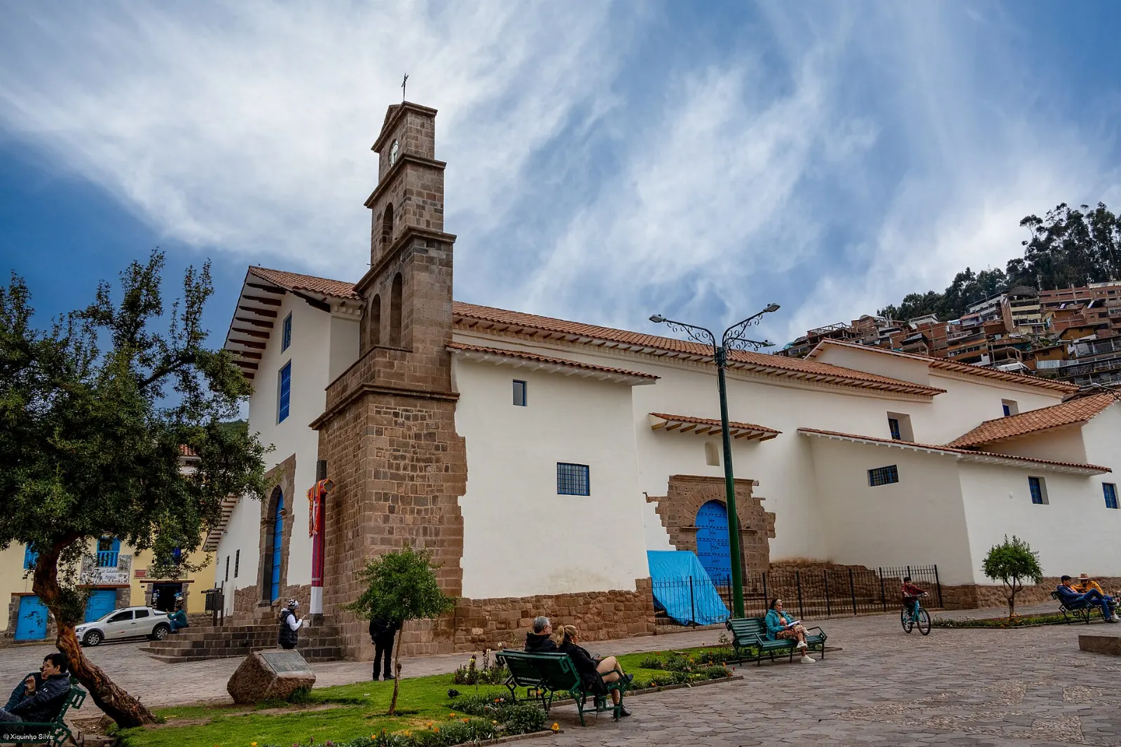 Whitewashed buildings and blue balconies on a steep street in San Blas, Cusco and Machu Picchu, Peru
