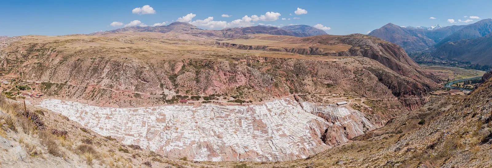 Hundreds of white and tan salt evaporation pools on a hillside near Maras, Cusco and Machu Picchu, Peru