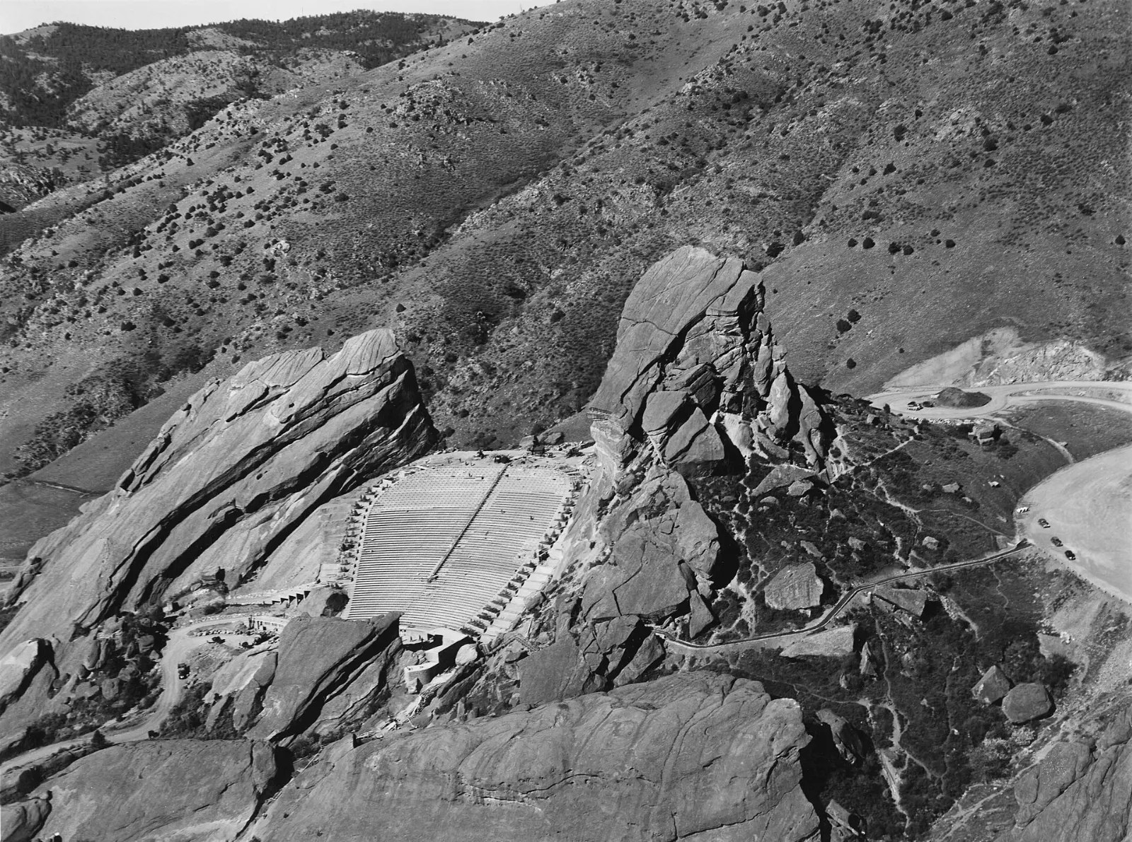 Tiered seating of Red Rocks Amphitheatre framed by two huge red sandstone monoliths, Denver, Colorado