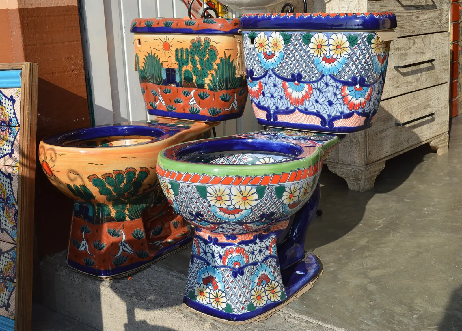 Colorful hand-painted ceramic plates and pots displayed outside a shop, Dolores Hidalgo, Guanajuato