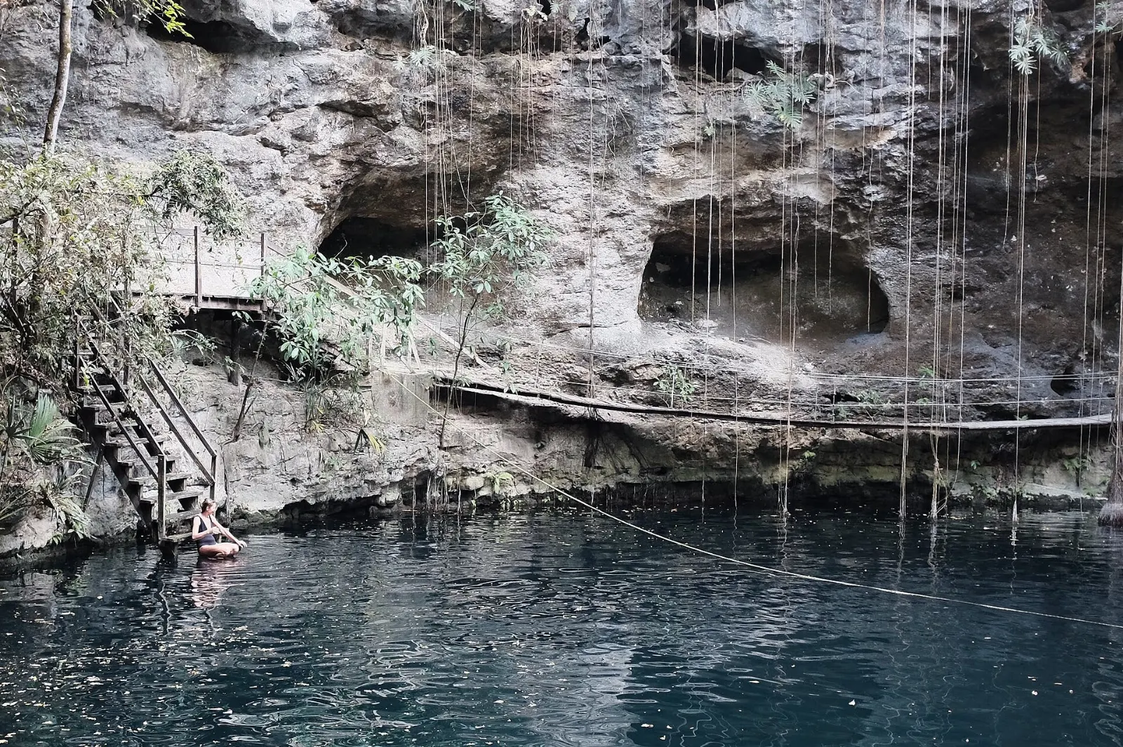 Blue water and a wooden platform at Cenote X'Canche near Ek Balam, Yucatán